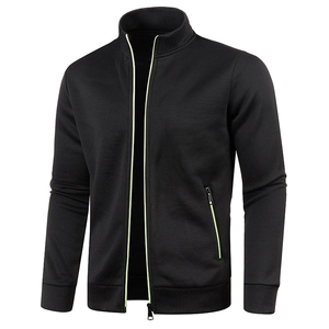 Detail view of black men's knit jacket showing neon green zipper and stand collar