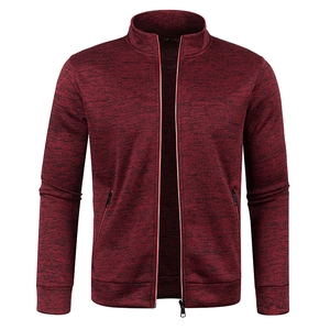 Detail of burgundy knit cardigan with stand collar and hidden zipper side pockets