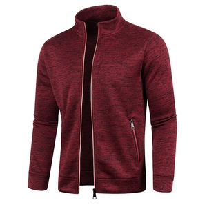 Close-up of heathered red knit sweater jacket showing high collar and zipper details