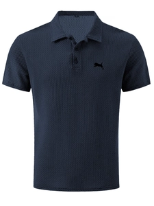 Detail of navy waffle knit polo shirt with breathable mesh texture and classic collar