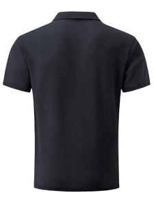 Rear view of men's navy blue polo shirt with premium waffle knit mesh texture detail