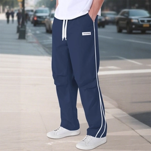 Men's deep blue straight-leg track pants with side stripes and drawstring waist