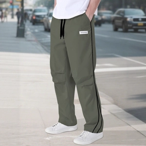 Olive green street style cargo pants for men with side stripes and elastic waist
