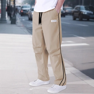 Men's khaki loose cargo pants with side stripes and elastic drawstring waist for outdoor sports