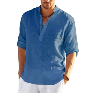 Detail of blue men's linen shirt showing Henley collar and textured breathable fabric