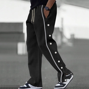 Pantalon de jogging noir pour homme avec boutons-pression latéraux et rayures contrastées
