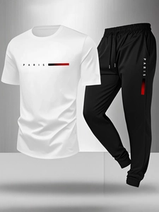 Detail of white T-shirt and black joggers set with Paris logo and gradient stripes