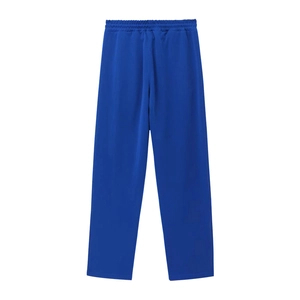 Detail view of royal blue joggers with elastic drawstring waistband on white background