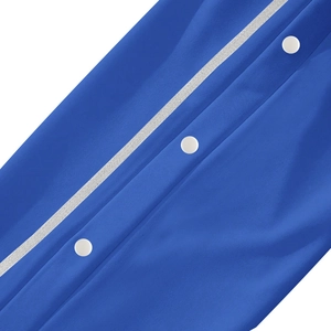 Macro detail of blue casual pants with white snap buttons and vertical ribbon trim