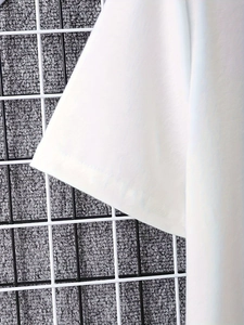 Close-up of white t-shirt sleeve cuff detail with neat stitching and cotton fabric