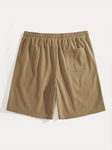 Detailed macro view of khaki waffle texture fabric and back pocket on men casual shorts