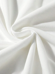 Macro shot of white knitted fabric showing soft breathable texture of the men's set