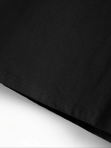 Detail shot of black high-density fabric showing precise double-needle stitching on the hem