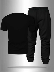 Detail view of black breathable athletic set featuring drawstring waist and knit fabric