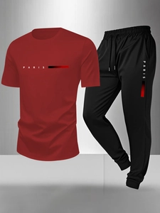 Detail of red athletic T-shirt and black joggers set with breathable PARIS print fabric