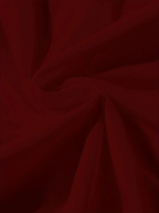 Close-up of wine red lightweight breathable fabric with elegant natural drapes and texture