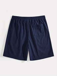 Detail of navy blue waffle knit fabric and elastic waistband on men's casual shorts