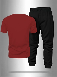 Detail view of the back of a men's breathable dark red t-shirt and black joggers set