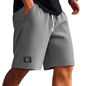 Pantaloncini casual da uomo grigi in maglia a nido d'ape con coulisse e tasche