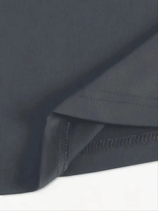 Detailed close-up of double-needle stitching and hem finish on grey knit sportswear set
