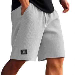 Pantaloncini uomo grigi in maglia a nido d'ape con coulisse ed etichetta classica