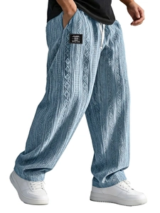 Close-up of blue textured jacquard fabric pattern on men's wide-leg lounge pants