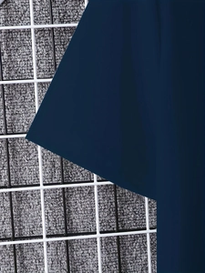 Close-up detail showing the dark blue breathable fabric texture of the men's set