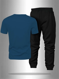 Detailed flat lay of navy blue sports t-shirt and black joggers with elastic waist
