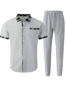 Detail of waffle knit fabric with contrast plaid trim on short sleeve shirt and trousers