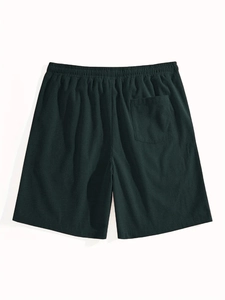 Close-up of deep green waffle texture fabric and elastic waistband on casual shorts