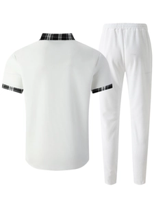 Rear view of men's white waffle knit polo shirt and pants with plaid collar detail