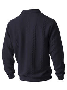 Detail of dark blue cable knit texture and ribbed cuffs on men's long sleeve sweater
