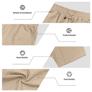 Detail view of khaki waffle knit shorts showing elastic drawstring waist and side pockets