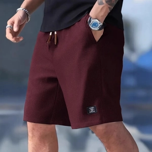 Men's waffle knit drawstring shorts in burgundy red with elastic waist and side pockets