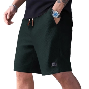 Men's dark green waffle knit shorts with elastic drawstring waist and side pockets