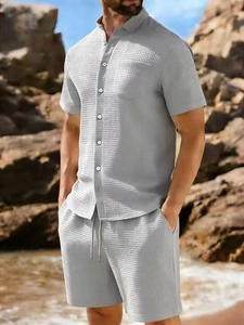 Detail of light gray waffle knit fabric on men's summer short sleeve shirt and shorts set