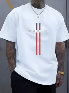 Close-up of Paris lettering and red black gradient stripes on loose white cotton T-shirt