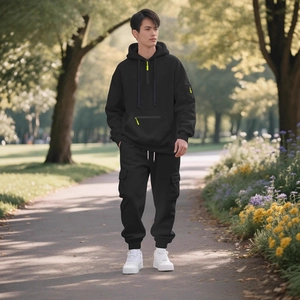 Men's black hooded tracksuit set with neon green zippers and cargo jogger pants
