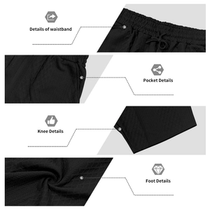 Detail of black leisure shorts with textured diamond pattern and elastic drawstring waist