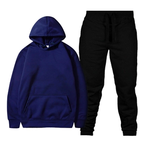 Flat lay of navy blue hooded sweatshirt with kangaroo pocket and black drawstring joggers set