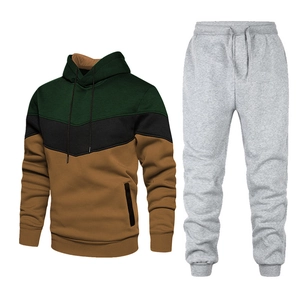 Detail of multi-color paneled drawstring hoodie and classic grey joggers sports set