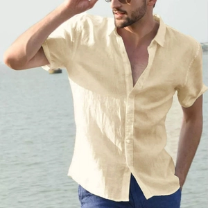 Detail of light beige men's cotton linen short sleeve shirt with breathable fabric texture
