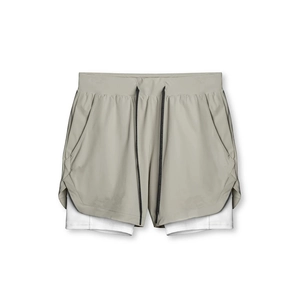 Men's athletic shorts detail showing the quick-dry fabric and adjustable drawstring design.