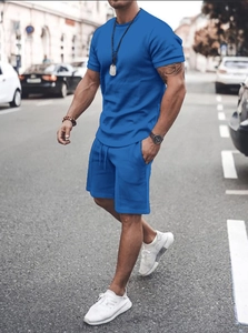 Detail of men's bright royal blue short sleeve sports t-shirt and drawstring shorts set