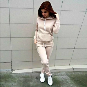 Detail view of beige fleece tracksuit with drawstring hoodie and jogger pants for women