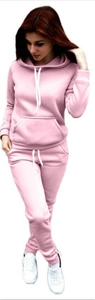 Detail view of pink fleece hoodie and jogger set with drawstring hood and kangaroo pockets