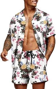 Detail shot of tropical pineapple and palm leaf print on white summer shirt and shorts set