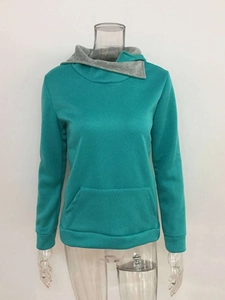 Detail view of long sleeve hoodie with gray crossover collar and teal fabric texture