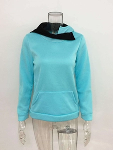Detail of light blue pullover hoodie with black contrast hood lining and ribbed cuffs