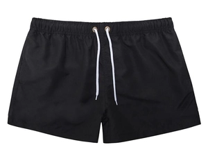 Detail of men's black quick-dry swim trunks featuring an elastic waistband and white drawstrings
